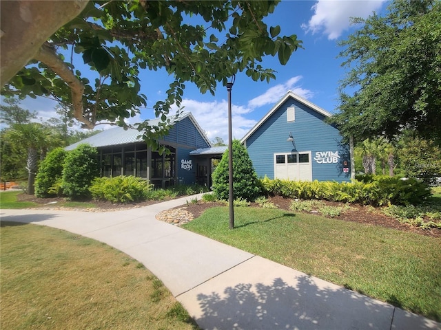 18144 Frame Bnd, Land O Lakes, FL 34638 - single story home featuring a front yard and a sunroom