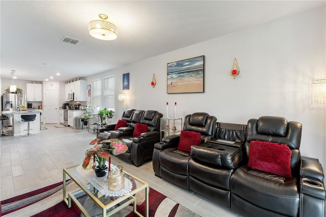 39024 Harlow Rose Dr, Zephyrhills, FL 33540 - living area with light wood-style flooring