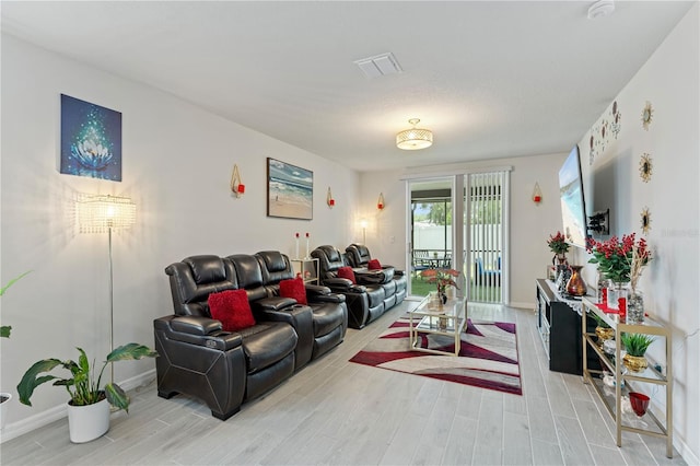39024 Harlow Rose Dr, Zephyrhills, FL 33540 - living room with light wood-style flooring