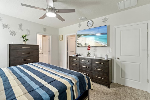 39024 Harlow Rose Dr, Zephyrhills, FL 33540 - bedroom featuring light colored carpet, ceiling fan, and a textured ceiling