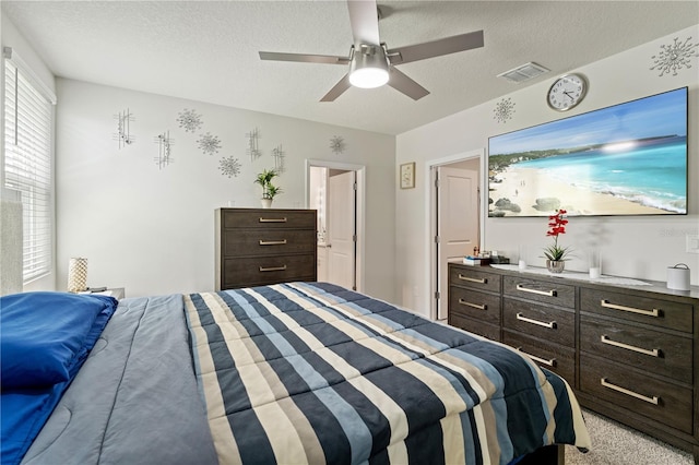 39024 Harlow Rose Dr, Zephyrhills, FL 33540 - bedroom with a textured ceiling and ceiling fan