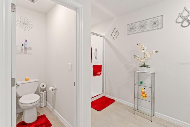 39024 Harlow Rose Dr, Zephyrhills, FL 33540 - full bath featuring a stall shower and wood finished floors
