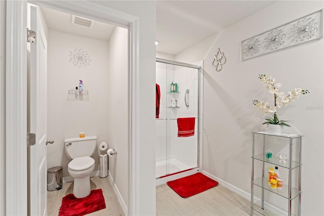 39024 Harlow Rose Dr, Zephyrhills, FL 33540 - full bathroom featuring toilet and a stall shower