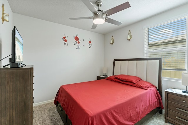 39024 Harlow Rose Dr, Zephyrhills, FL 33540 - carpeted bedroom with baseboards and a ceiling fan