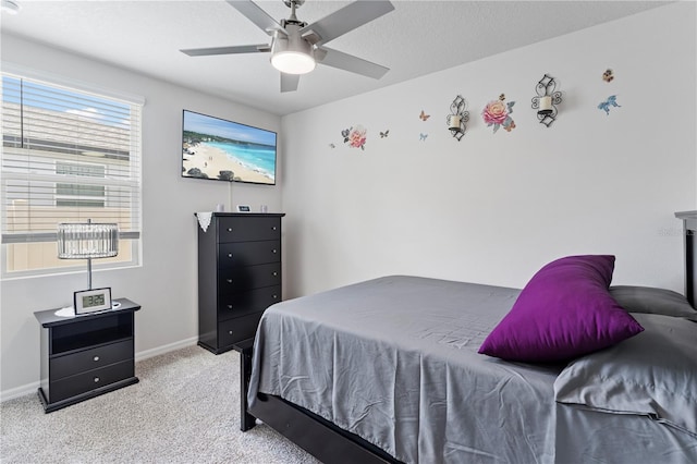 39024 Harlow Rose Dr, Zephyrhills, FL 33540 - bedroom with light colored carpet and a ceiling fan