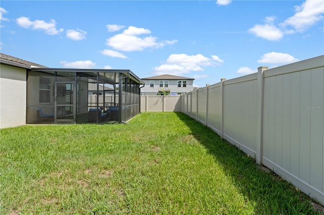 39024 Harlow Rose Dr, Zephyrhills, FL 33540 - fenced backyard with a sunroom