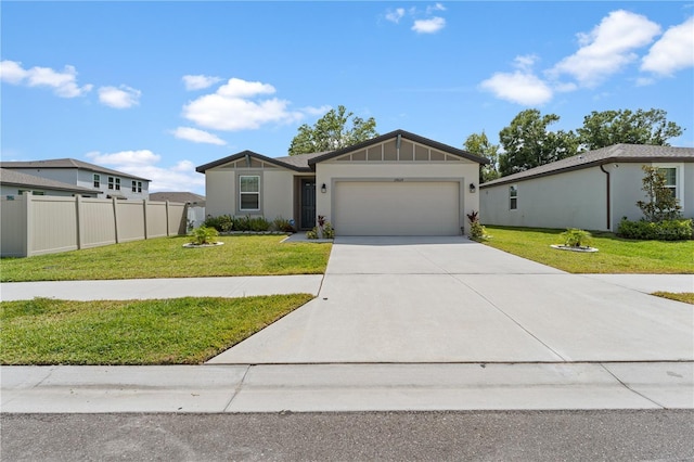 39024 Harlow Rose Dr, Zephyrhills, FL 33540 - view of front of house featuring an attached garage, concrete driveway, and stucco siding