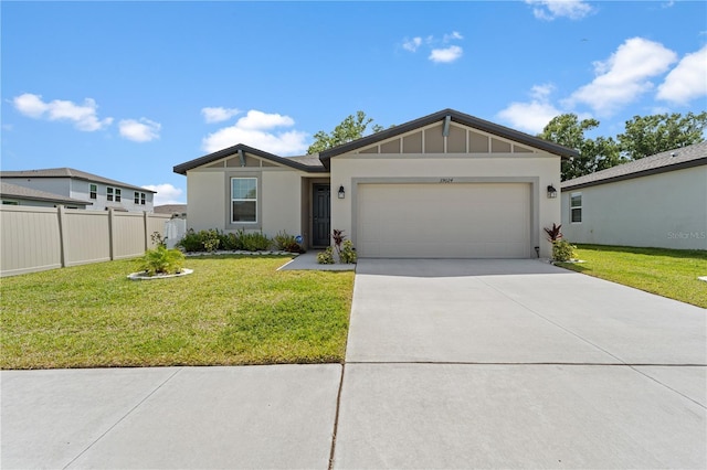 39024 Harlow Rose Dr, Zephyrhills, FL 33540 - view of front of house with stucco siding, a garage, and concrete driveway