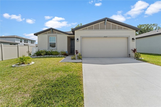39024 Harlow Rose Dr, Zephyrhills, FL 33540 - single story home with driveway, an attached garage, and stucco siding