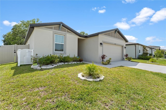 39024 Harlow Rose Dr, Zephyrhills, FL 33540 - view of front of house with concrete driveway, an attached garage, and stucco siding