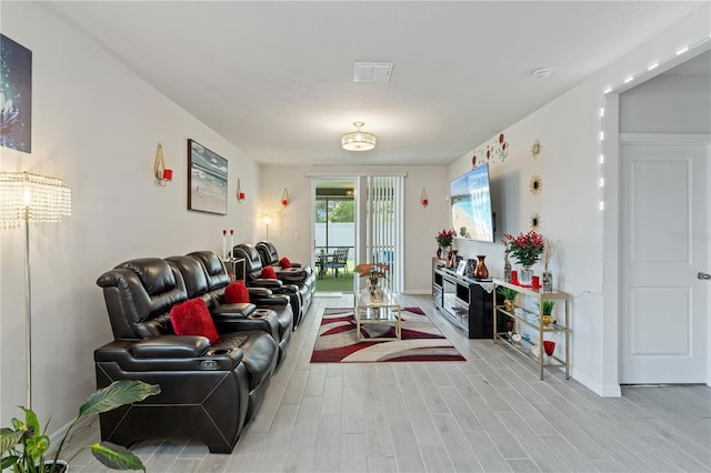 39024 Harlow Rose Dr, Zephyrhills, FL 33540 - living area featuring light wood-type flooring and baseboards