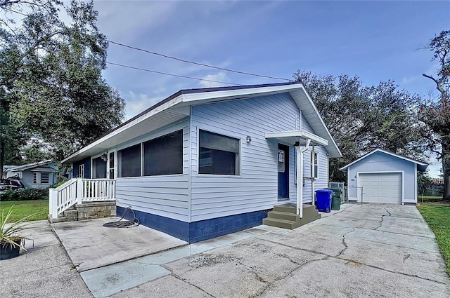 1938 E Fern Rd, Lakeland, FL 33801 - view of front of property featuring an outbuilding, a garage, and asphalt driveway