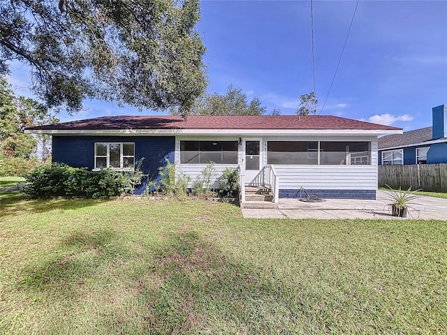 1938 E Fern Rd, Lakeland, FL 33801 - rear view of property featuring a sunroom, a patio, and entry steps