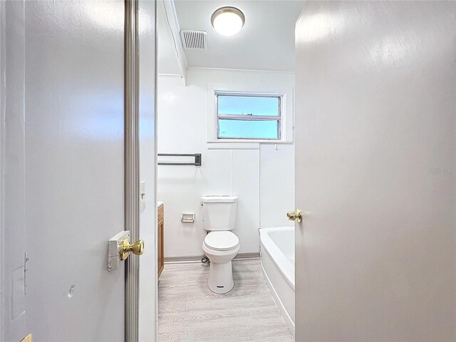 1938 E Fern Rd, Lakeland, FL 33801 - full bathroom with wood finished floors, a bathtub, a shower, and vanity