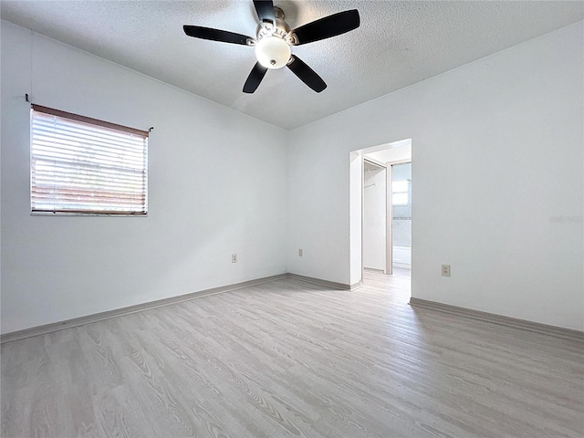 1938 E Fern Rd, Lakeland, FL 33801 - unfurnished room featuring light wood finished floors, a textured ceiling, and a ceiling fan