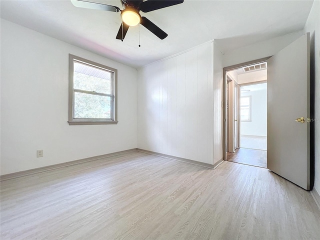 1938 E Fern Rd, Lakeland, FL 33801 - empty room with light wood-type flooring, healthy amount of natural light, and a ceiling fan