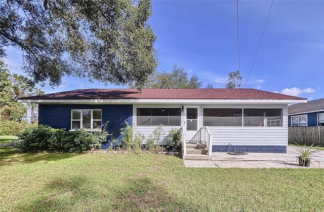1938 E Fern Rd, Lakeland, FL 33801 - view of front of house featuring a sunroom and a patio area