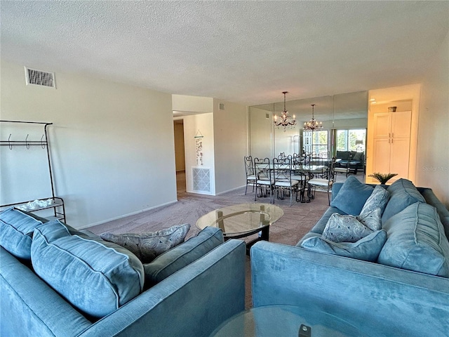 2070 World Parkway Blvd Unit 36, Clearwater, FL 33763 - living room featuring carpet flooring, a chandelier, and a textured ceiling