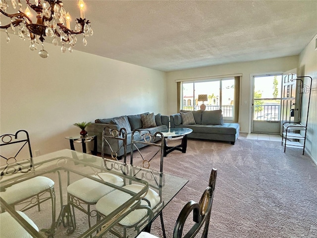 2070 World Parkway Blvd Unit 36, Clearwater, FL 33763 - living area featuring carpet flooring, plenty of natural light, a chandelier, and a textured ceiling