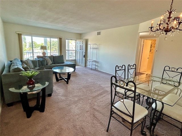 2070 World Parkway Blvd Unit 36, Clearwater, FL 33763 - living room with carpet, a chandelier, and a textured ceiling