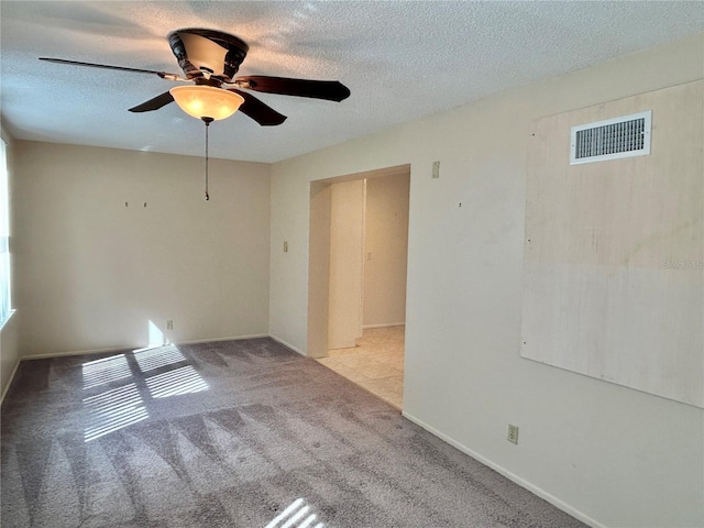2070 World Parkway Blvd Unit 36, Clearwater, FL 33763 - carpeted spare room with a ceiling fan and a textured ceiling