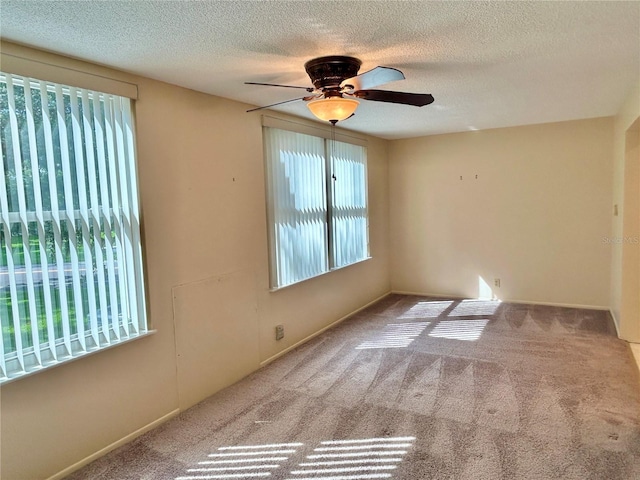 2070 World Parkway Blvd Unit 36, Clearwater, FL 33763 - spare room featuring a ceiling fan, a textured ceiling, and carpet floors