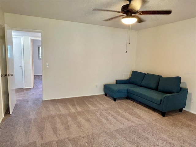 2070 World Parkway Blvd Unit 36, Clearwater, FL 33763 - living area featuring carpet floors, a textured ceiling, and ceiling fan
