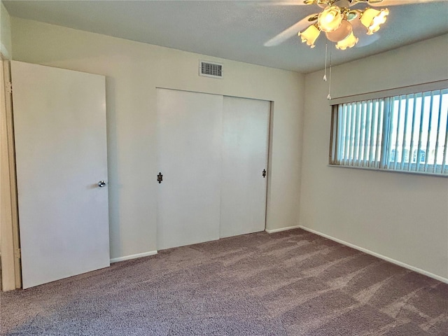 2070 World Parkway Blvd Unit 36, Clearwater, FL 33763 - unfurnished bedroom with carpet, a closet, and a ceiling fan