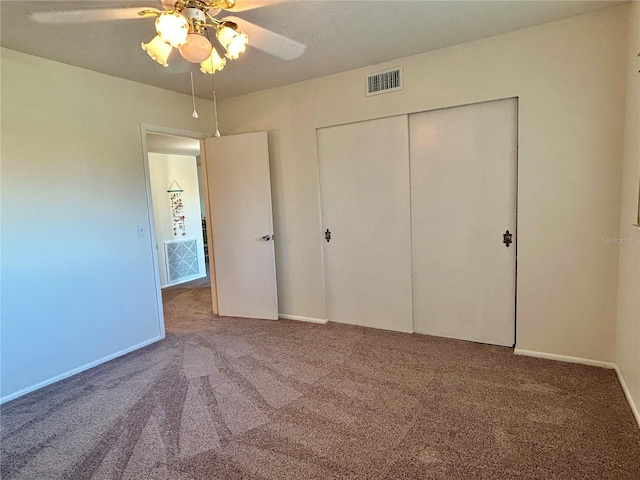 2070 World Parkway Blvd Unit 36, Clearwater, FL 33763 - unfurnished bedroom with carpet flooring, a closet, and a ceiling fan