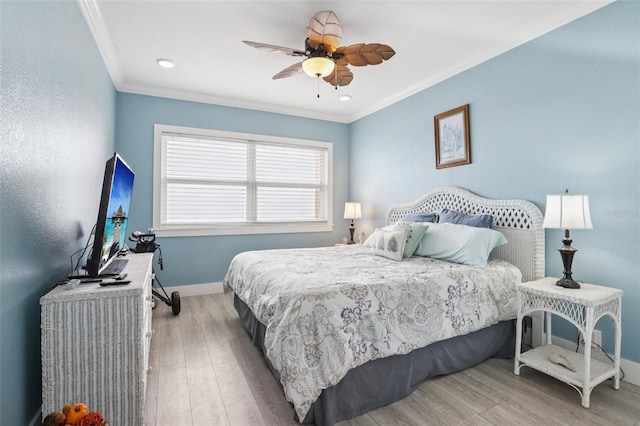 880 Mandalay Ave Unit C513, Clearwater Beach, FL 33767 - bedroom with crown molding, wood finished floors, and a ceiling fan