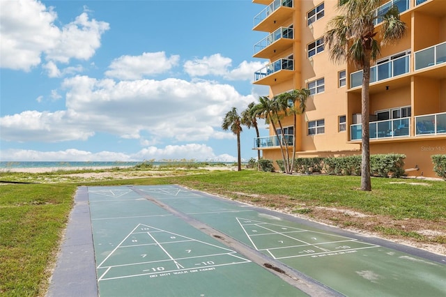 880 Mandalay Ave Unit C513, Clearwater Beach, FL 33767 - surrounding community with view of water and beach and a yard