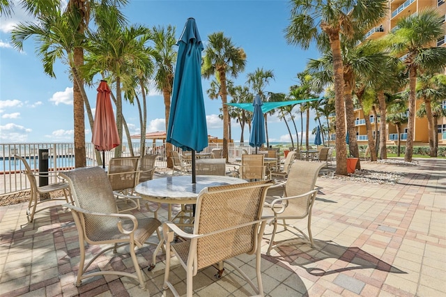 880 Mandalay Ave Unit C513, Clearwater Beach, FL 33767 - view of patio / terrace with outdoor dining area