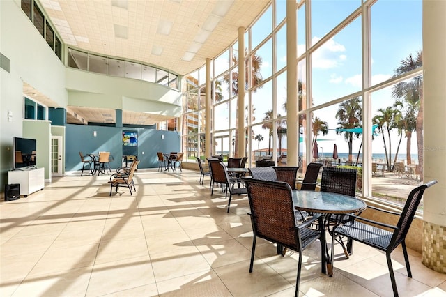 880 Mandalay Ave Unit C513, Clearwater Beach, FL 33767 - community lobby with a towering ceiling and expansive windows