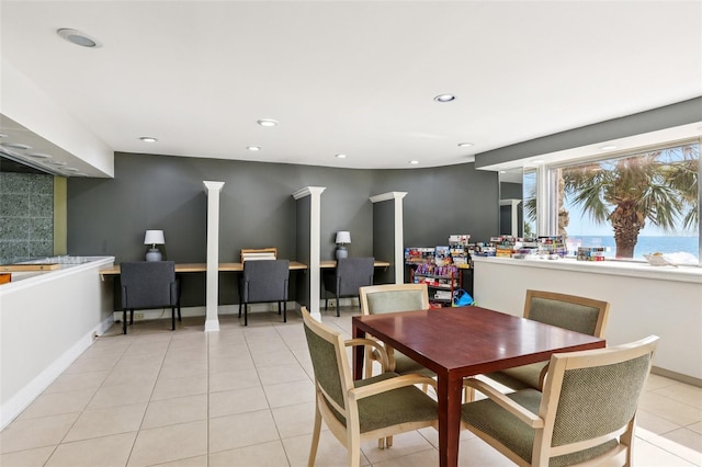 880 Mandalay Ave Unit C513, Clearwater Beach, FL 33767 - dining room with light tile patterned floors, recessed lighting, and decorative columns