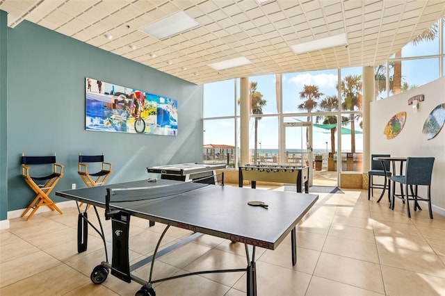 880 Mandalay Ave Unit C513, Clearwater Beach, FL 33767 - game room with floor to ceiling windows, tile patterned floors, and a high ceiling