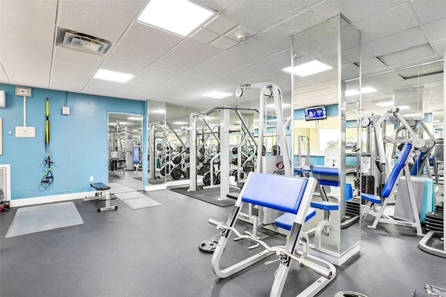 880 Mandalay Ave Unit C513, Clearwater Beach, FL 33767 - gym featuring a paneled ceiling and baseboards