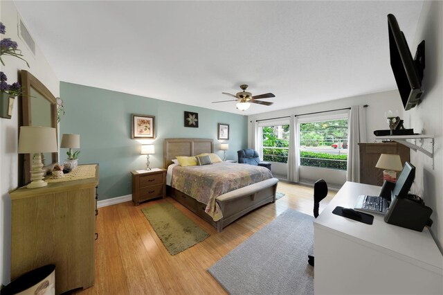 3035 Countryside Blvd Unit 16B, Clearwater, FL 33761 - bedroom with light wood-style floors and a ceiling fan