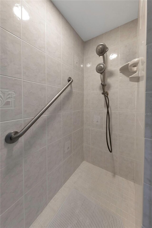 3035 Countryside Blvd Unit 16B, Clearwater, FL 33761 - full bathroom featuring tiled shower