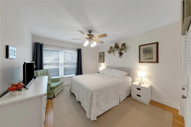 3035 Countryside Blvd Unit 16B, Clearwater, FL 33761 - bedroom featuring light wood-style floors and a ceiling fan