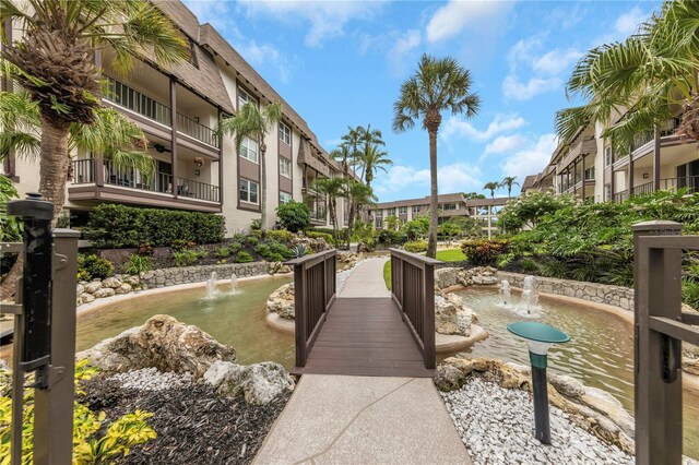 3035 Countryside Blvd Unit 16B, Clearwater, FL 33761 - view of property's community with a garden pond