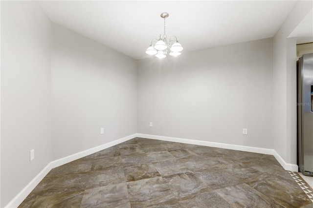3753 Thornbush Ln, New Port Richey, FL 34655 - spare room featuring a chandelier and baseboards