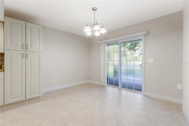 3753 Thornbush Ln, New Port Richey, FL 34655 - spare room featuring a chandelier and light tile patterned floors