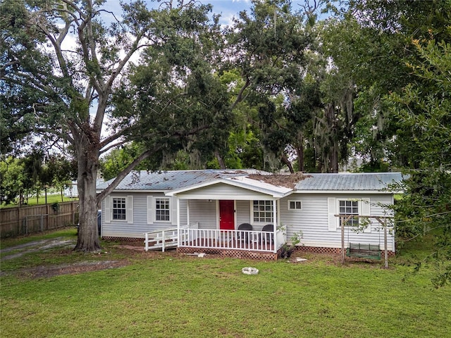 11704 Orange Grove Ter, Riverview, FL 33569 - back of house with covered porch and a metal roof