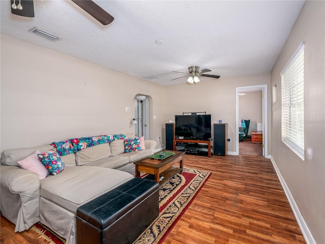 11704 Orange Grove Ter, Riverview, FL 33569 - living room with ceiling fan, wood finished floors, and arched walkways