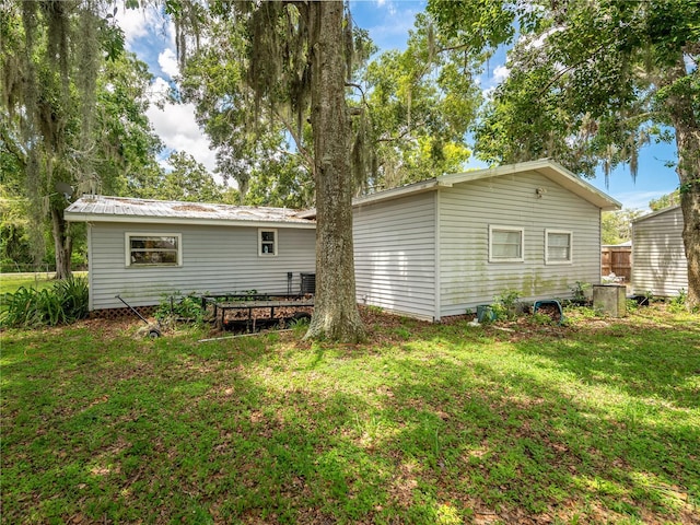 11704 Orange Grove Ter, Riverview, FL 33569 - back of house with a lawn