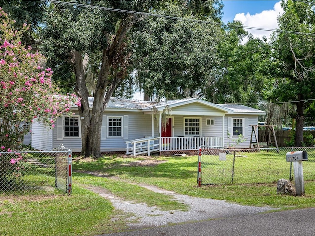 11704 Orange Grove Ter, Riverview, FL 33569 - ranch-style home with covered porch and a fenced front yard
