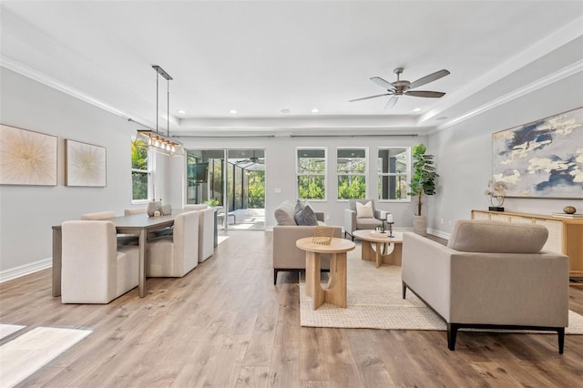 12121 Rustic River Way, Tampa, FL 33635 - living room with a ceiling fan, wood finished floors, ornamental molding, recessed lighting, and a raised ceiling