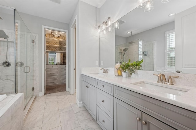 12121 Rustic River Way, Tampa, FL 33635 - bathroom with double vanity, a shower stall, and marble look tile flooring