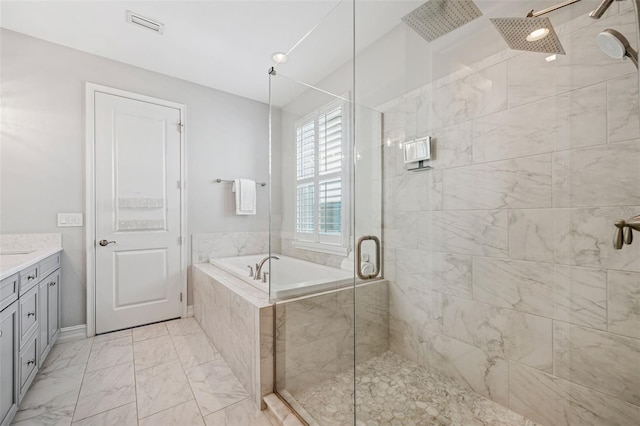12121 Rustic River Way, Tampa, FL 33635 - bathroom featuring a shower stall, a garden tub, vanity, and marble look tiles