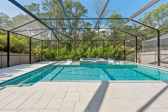 12121 Rustic River Way, Tampa, FL 33635 - view of pool with a pool with connected hot tub, a patio area, and glass enclosure